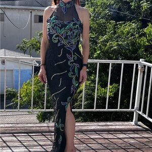 NWT beautiful beaded dress with slit in front. Never worn. Size 7/8. Paid $497.